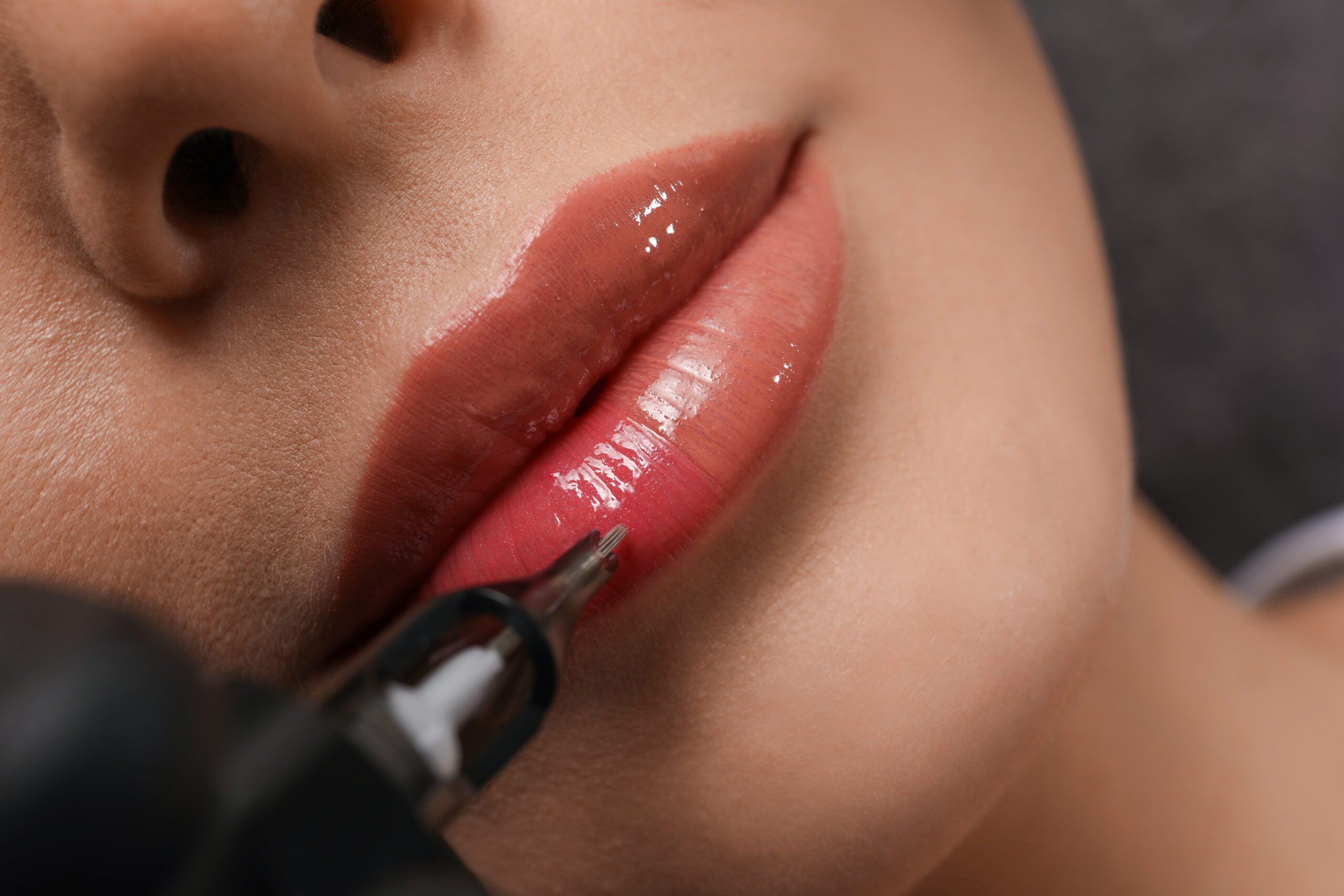 Woman receiving lip blush tattoo services at Haven Permanent Cosmetics