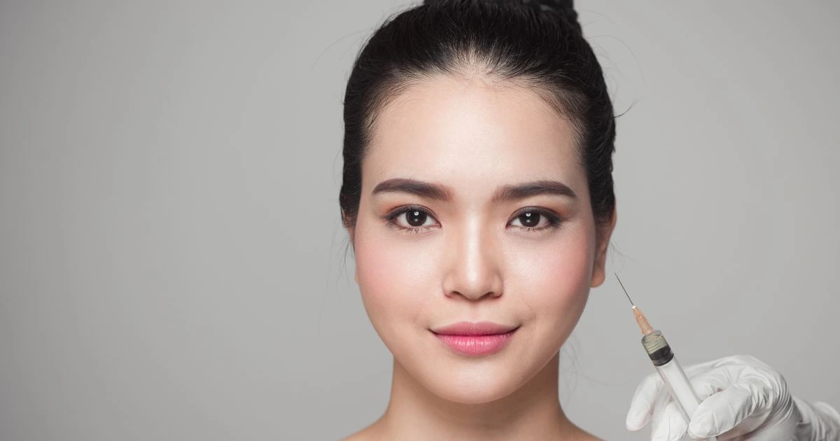 Botox or Fillers procedure on a clients cheekjawline for natural facial rejuvenation.