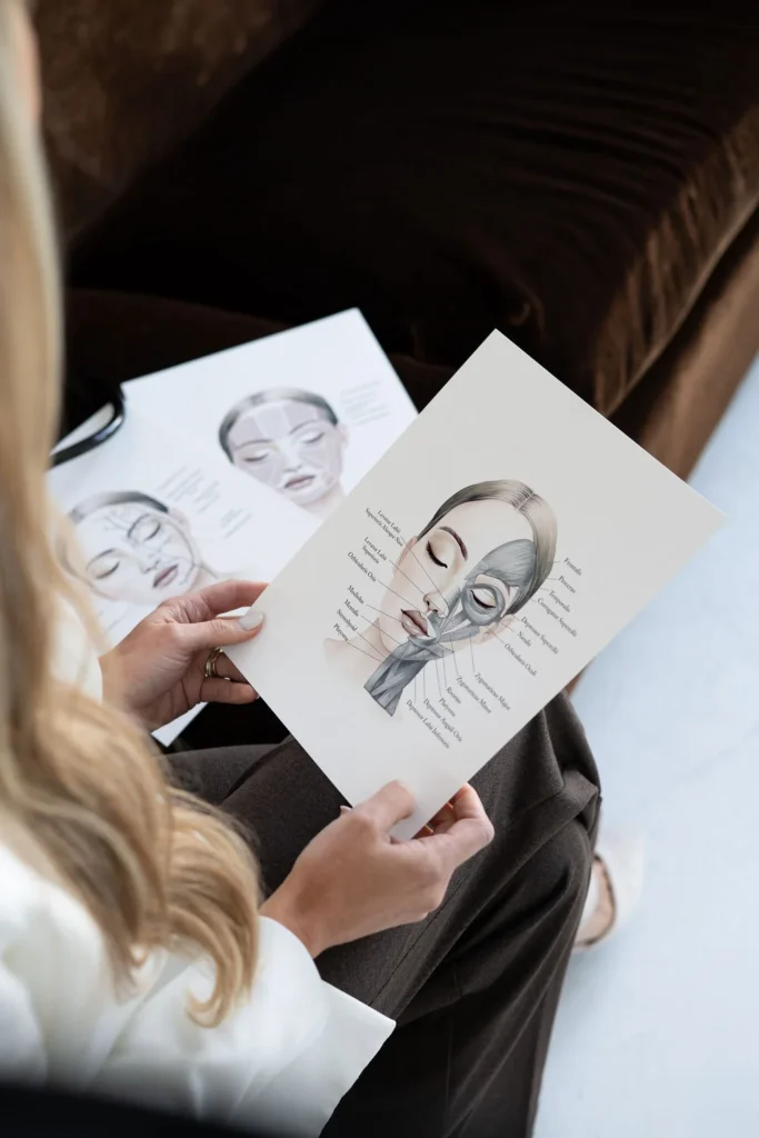 Sculptra treatment diagram on the female face during the treatment consultation at Haven Permanent Cosmetics & Aesthetics